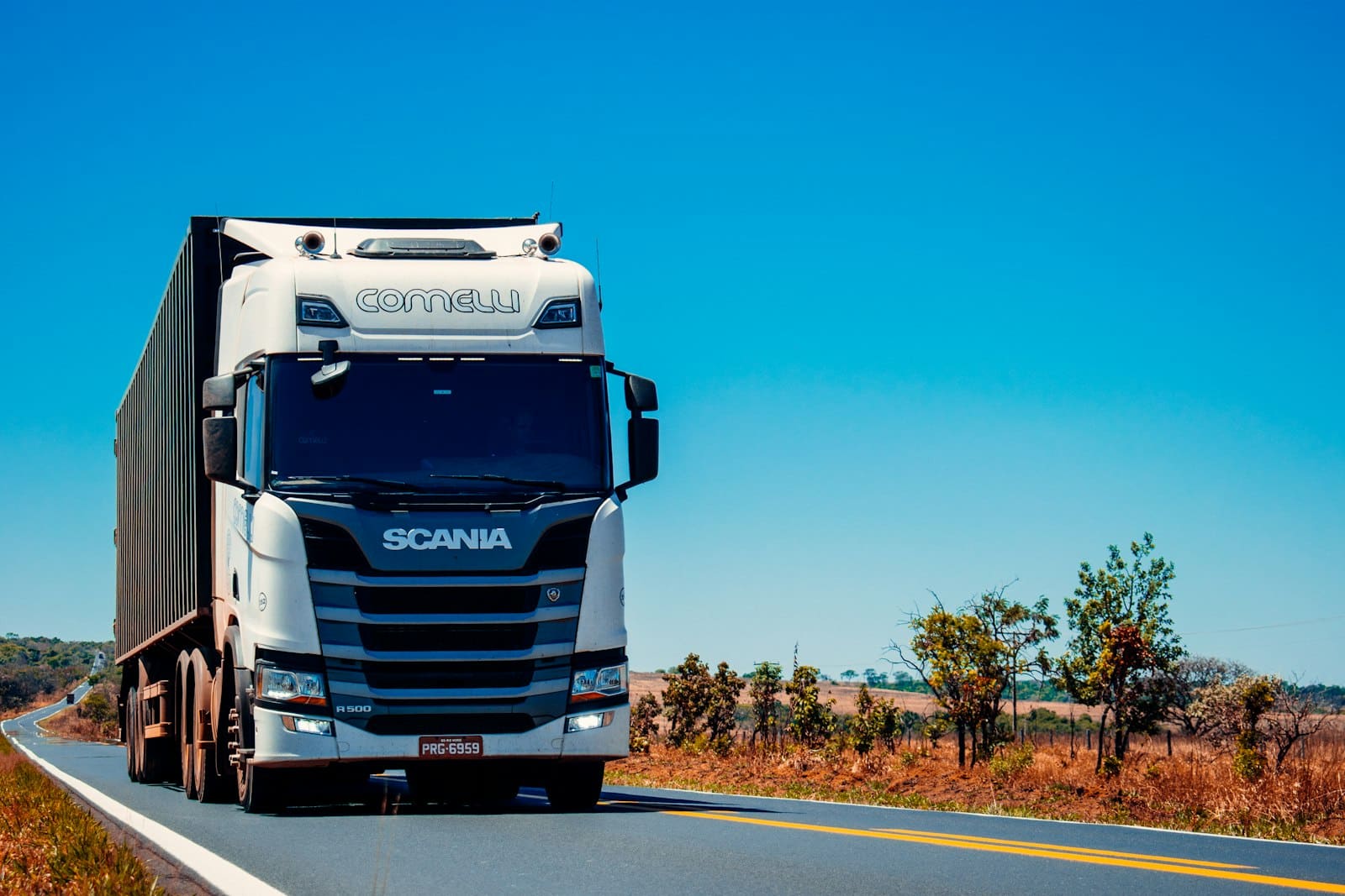 Truck moving containerised cargo along a Pakistani highway
